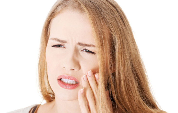 Woman with TMJ symptoms in pain